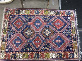 A hand woven rug, dimensions 105x155cm