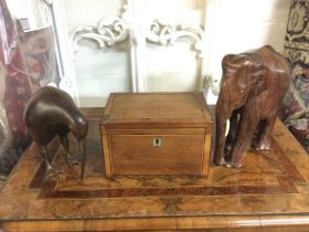 A regency mahogany tea caddy, a rosewood elephant and a kiwi (3). Shipping category B.