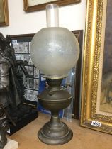 A brass oil lamp. Shipping category D.