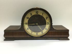 An oak eight day mantle clock. Shipping category D