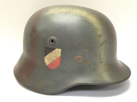 A three tone camouflage Wehrmacht M40 DD helmet, p