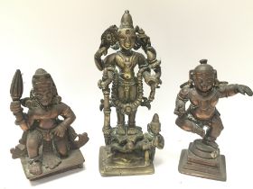 A trio of 19th century bronze deity figures, 9.5cm