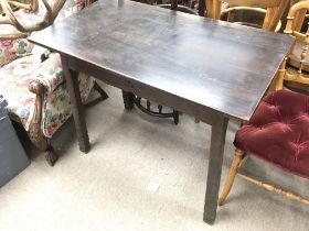 An arts and crafts pine stained table