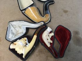 Three cased pipes including meerschaum and a Sherl