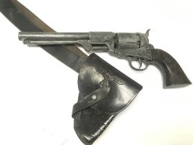 A BKA 98 Colt revolver replica with a black leathe