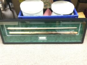 A framed and glazed multi signed snooker cue, vari