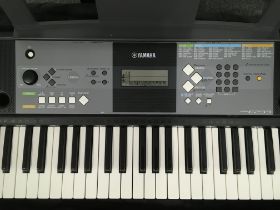 A pair of Yamaha Portable Keyboards comprising one