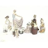A collection of Lladro porcelain figures , no obvi