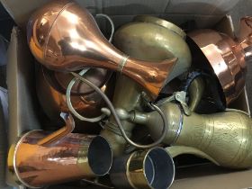 A collection of copper and brassware items includi