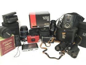 A collection of camera equipment including lenses,