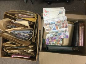 Two boxes of world stamps, loose and in albums. Sh