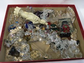 A collection of ornaments including Swarovski ornaments.