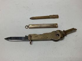 A 9ct gold pencil case and 9ct gold mounted key and knife case.