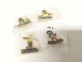 A collection of Vintage Golly badges including Bar