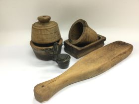 A set of bronze apothecary weights and some wooden