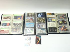 Three albums containing a large Coll of assorted p