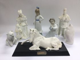 Seven ceramic figures comprising Lladro, Nao and o