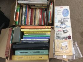Two boxes of automobile books and manuals plus a S
