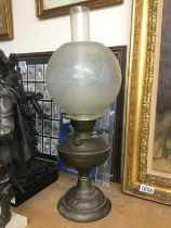 A brass oil lamp. Shipping category D.- NO RESERVE
