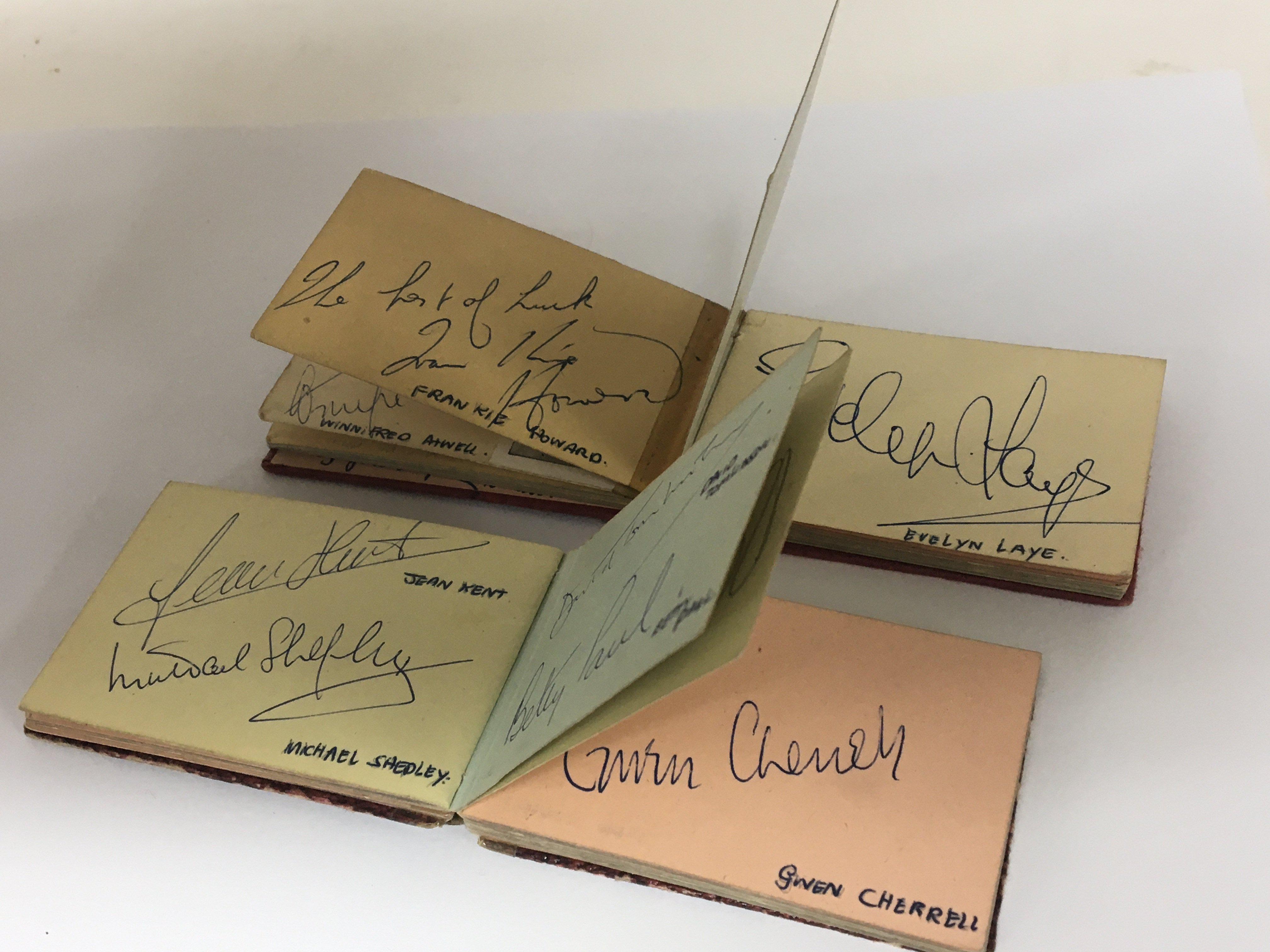 Two small signed autograph books including signatures of Gregory Peck ...
