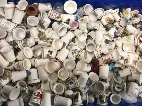 A collection of porcelain thimbles, postage catego