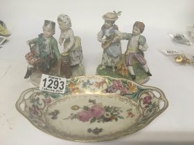 A pair of Dresden figures and a oval dish