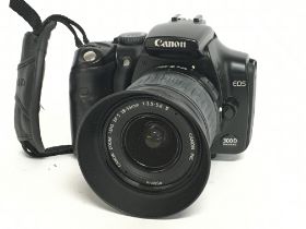 A Canon EOS 300D camera with EW-60C lens. Postage