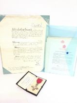 A cased MBE award medal and paperwork. Postage category C