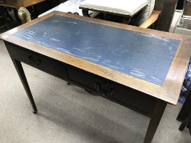 A Edwardian mahogany desk the rectangle top above two drawers on square tapering legs .