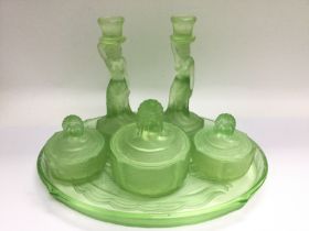 A 1930s Bagley green glass dressing table set. Shi