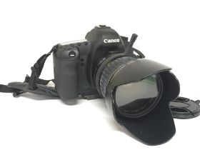 A canon EOS 5D camera with canon EW-78BII lens. Po