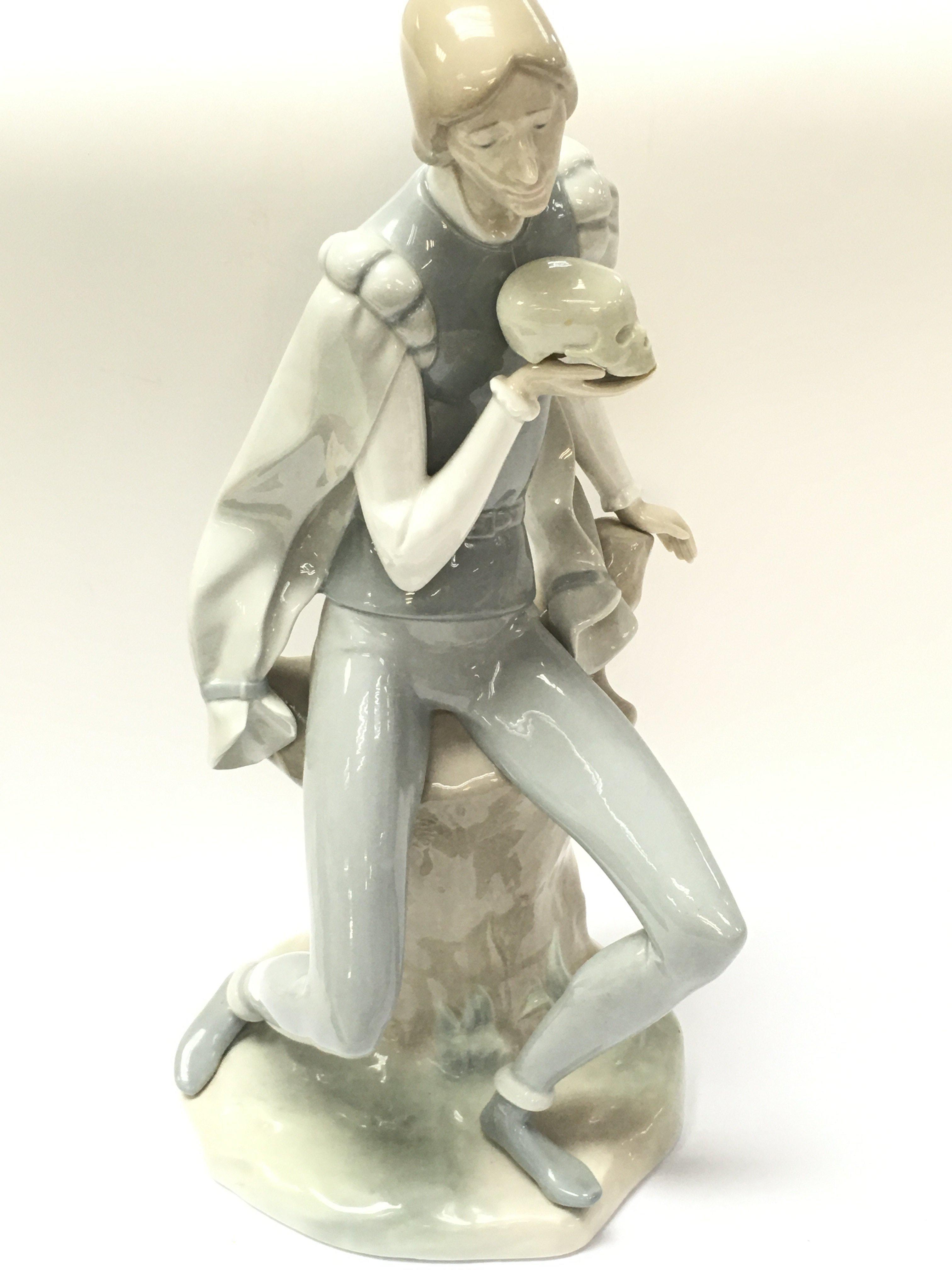 A large Lladro Hamlet figure, 38.5cm tall. Postage