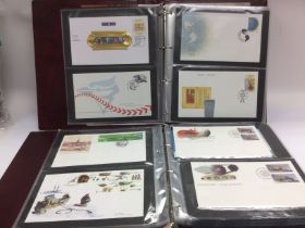 Four albums of Canadian first day covers. Shipping