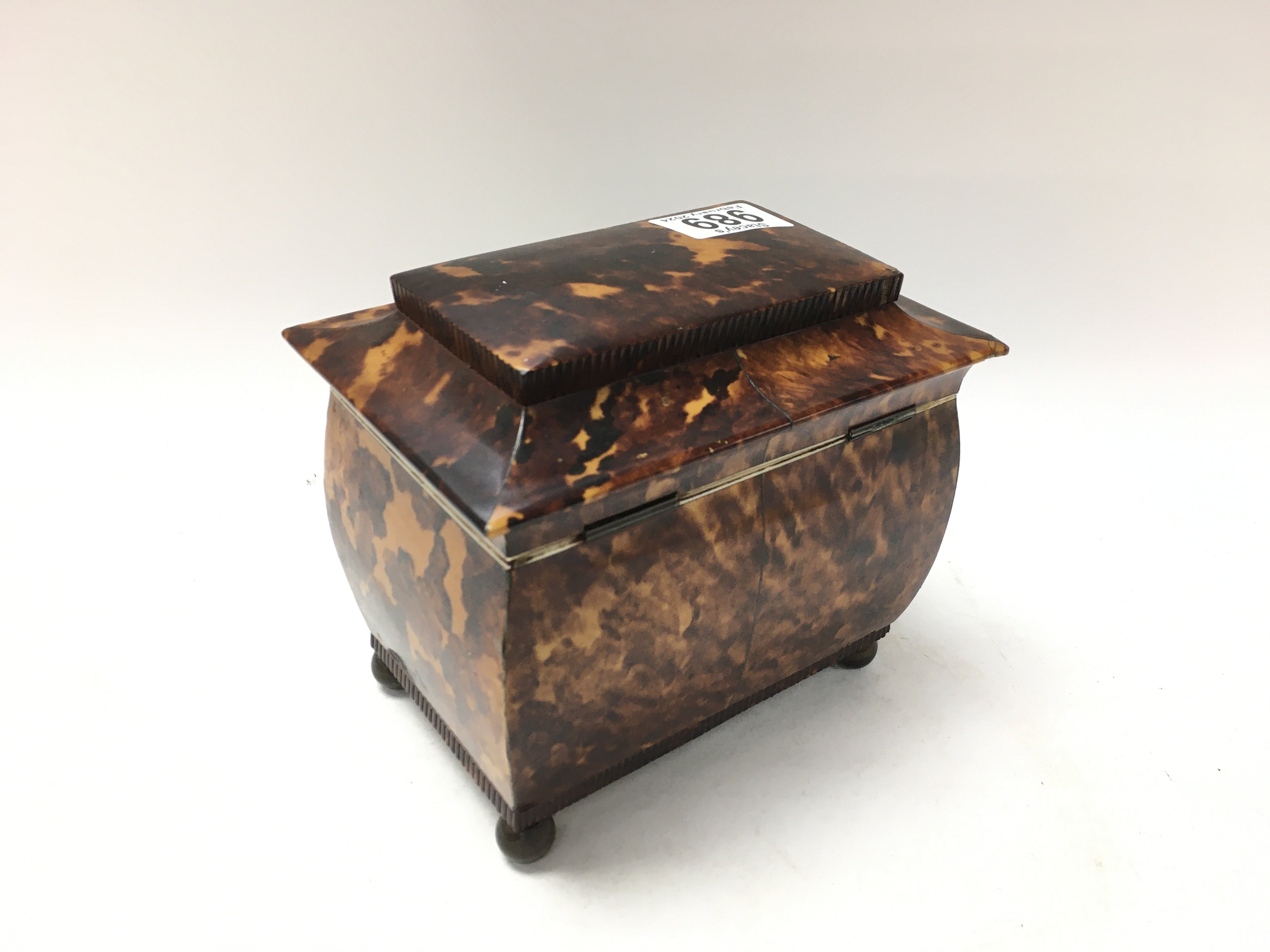 A tortoiseshell tea caddy with hinge lid enclosing 2 compartments. On brass circler feet. 15cm x - Image 3 of 3