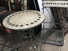 A mosaic marble and metal garden table and two matching chairs