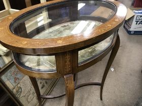 A Edwardian mahogany inlaid oval vitrine display cabinet on cabriole legs United by under