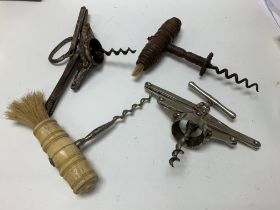Four antique corkscrews, two concertina and the other two are bone and wood turned.