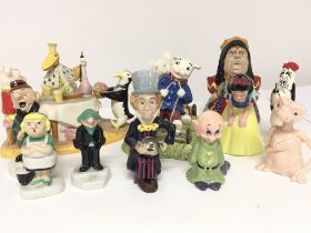 Two ceramic Royal Doulton figure groups Rupert the bear and other ceramic Disney figures. (a lot)