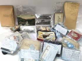 A Collection of vintage world postcards and cigare
