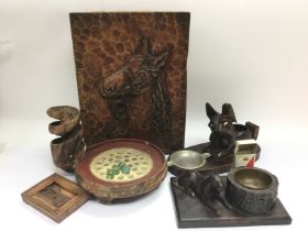 A black forest carved smoker's stand and one other