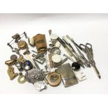 A collection of silver and other oddments including a pair of grape scissors , thimbles, watch keys,