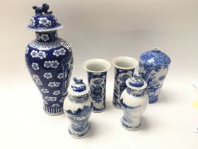 A collection of Chinese blue and white ceramics. 2 pairs of vases decorated with landscape views and