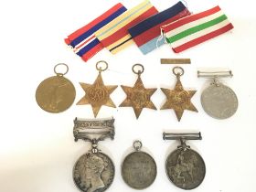 A collection of medals including WW1, WW2 and othe