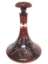 A Ruby bell shaped Glass decanter. 25cm tall. Post