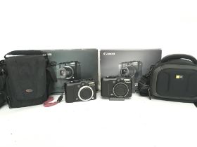 Boxed Canon Powershot cameras including the G7 & G