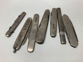 Seven silver pen knives.