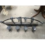 A wrought iron ceiling candle holder.