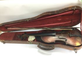 A cased violin. Shipping category D.