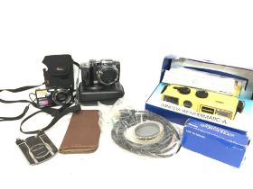 A collection of cameras including Sony Cyber Shot,