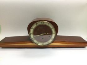 An Art deco design mahogany and satinwood mantle c